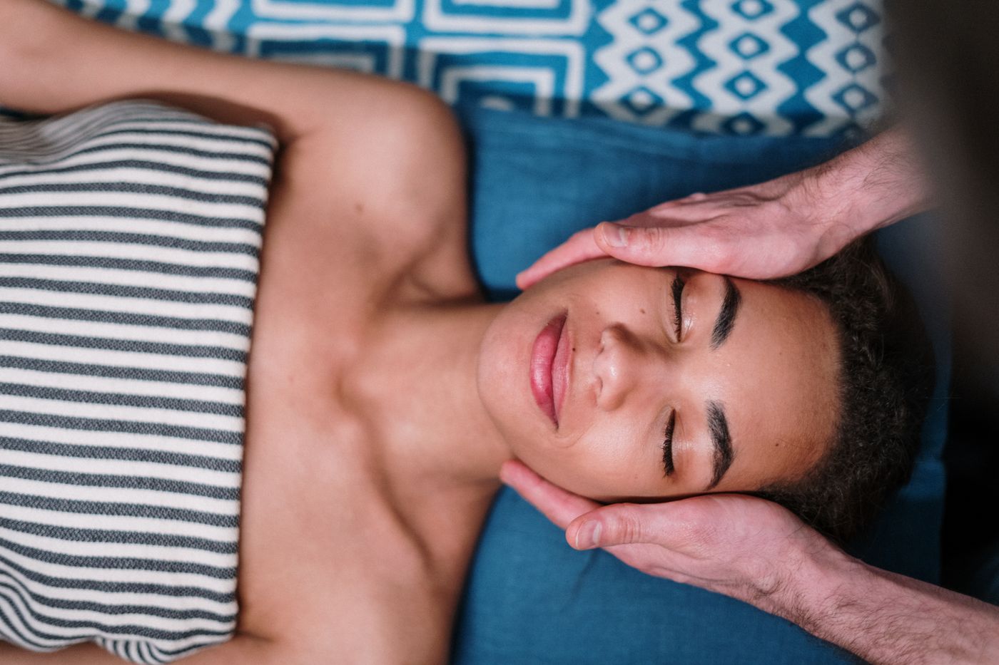 Client receiving a calming head and face massage